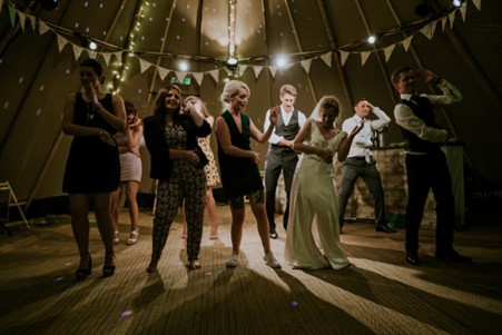 The Bride and Groom During a Choreographed Sequence with the Wedding Guests